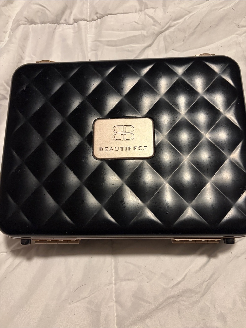 Beautifect Quilted Makeup Case in Black with Gold Plaque.